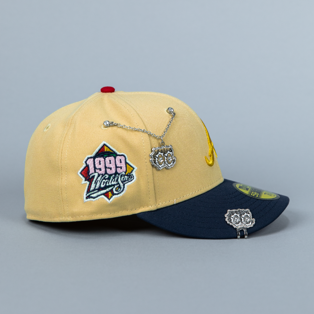 NEW ERA 59FIFTY VEGAS GOLD/ NAVY ATLANTA BRAVES W/ 1999 WORLD SERIES SIDE PATCH