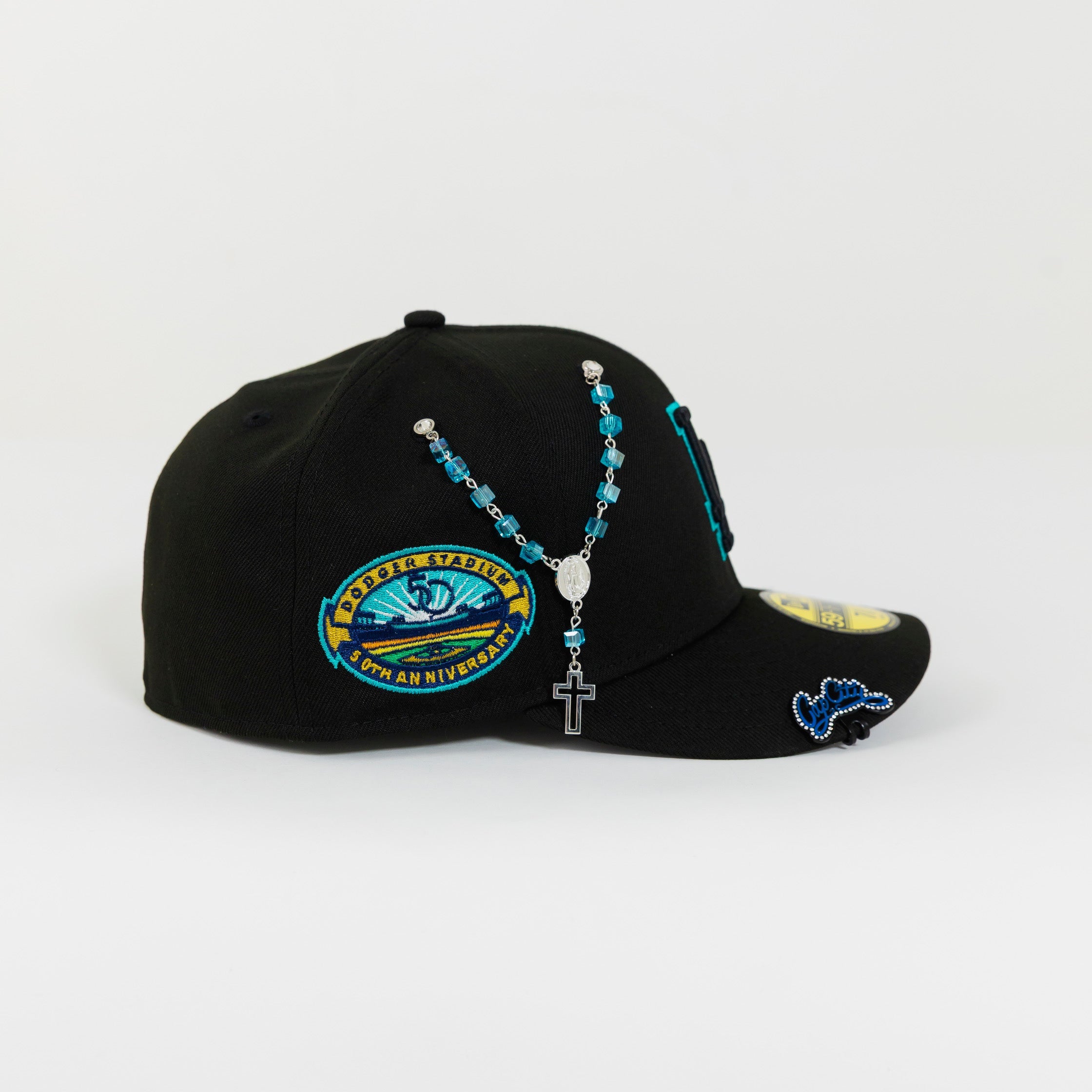 NEW ERA 59FIFTY BLACKED OUT LOS ANGELES DODGERS W/ TEAL OUTLINE + 50TH ANNIVERSARYSIDE PATCH