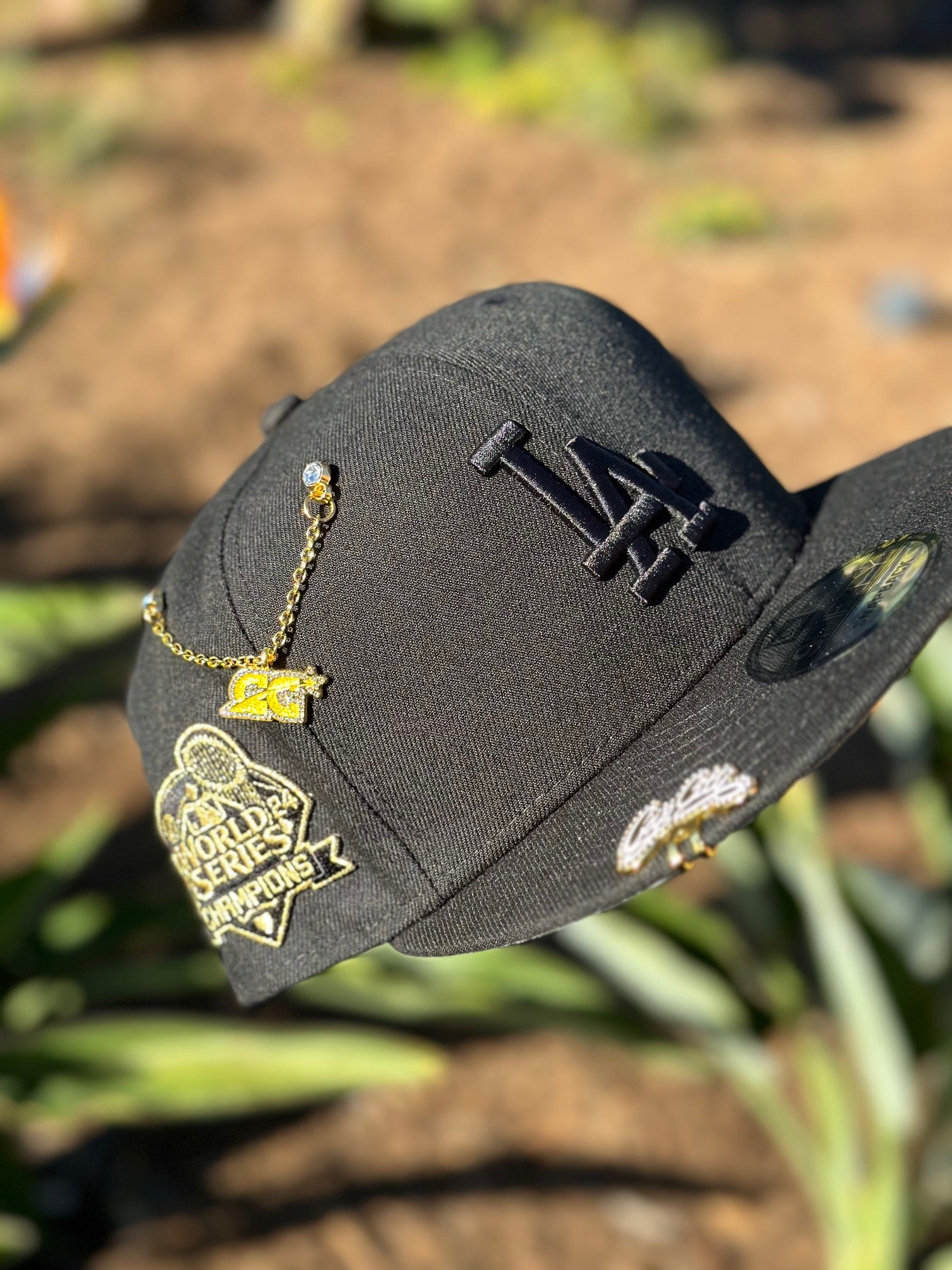 NEW ERA EXCLUSIVE 9FIFTY BLACKED OUT LOS ANGELES DODGERS SNAPBACK W/ 2024 WORLD SERIES CHAMPIONS SIDE PATCH