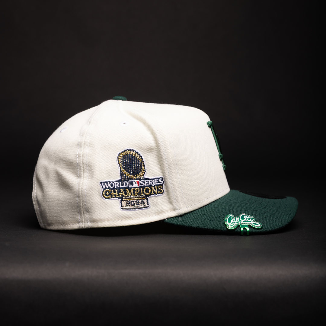 NEW ERA 9FIFTY A-FRAME CHROME/FOREST GREEN LOS ANGELES DODGERS SNAPBACK W/ WORLD SERIES CHAMPIONS SIDE PATCH