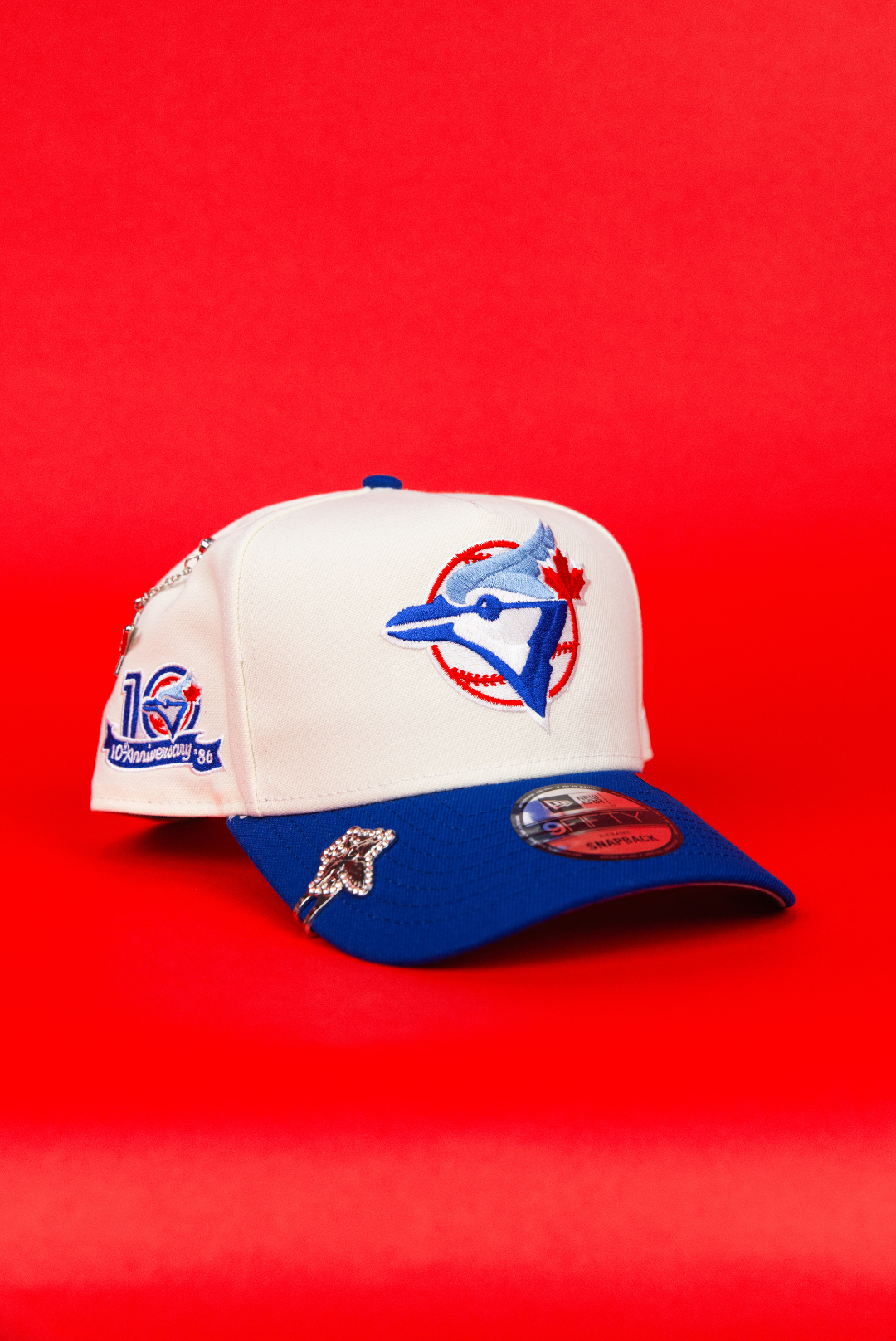 NEW ERA 9FIFTY A-FRAME CHROME/ BLUE TORONTO BLUE JAYS SNAPBACK W/ 10TH ANNIVERSARY SIDE PATCH