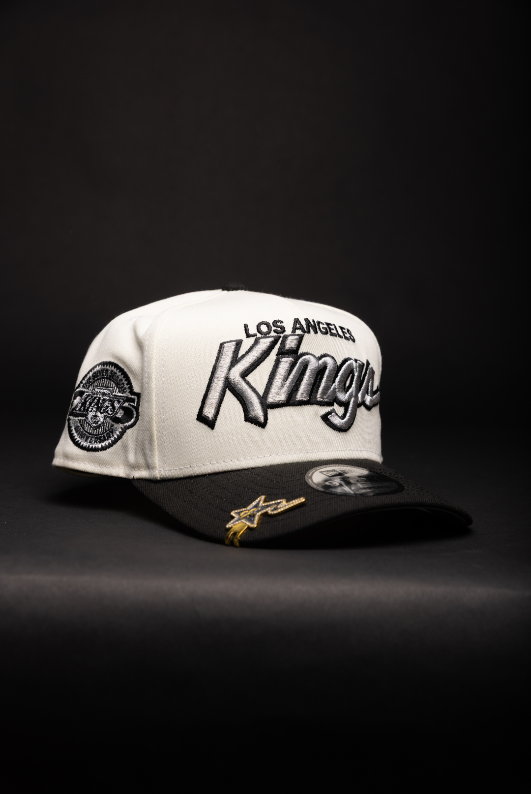 NEW ERA 9FIFTY A-FRAME CHROME/BLACK LOS ANGELES KINGS SCRIPT SNAPBACK W/ 25TH ANNIVERSARY SIDE PATCH