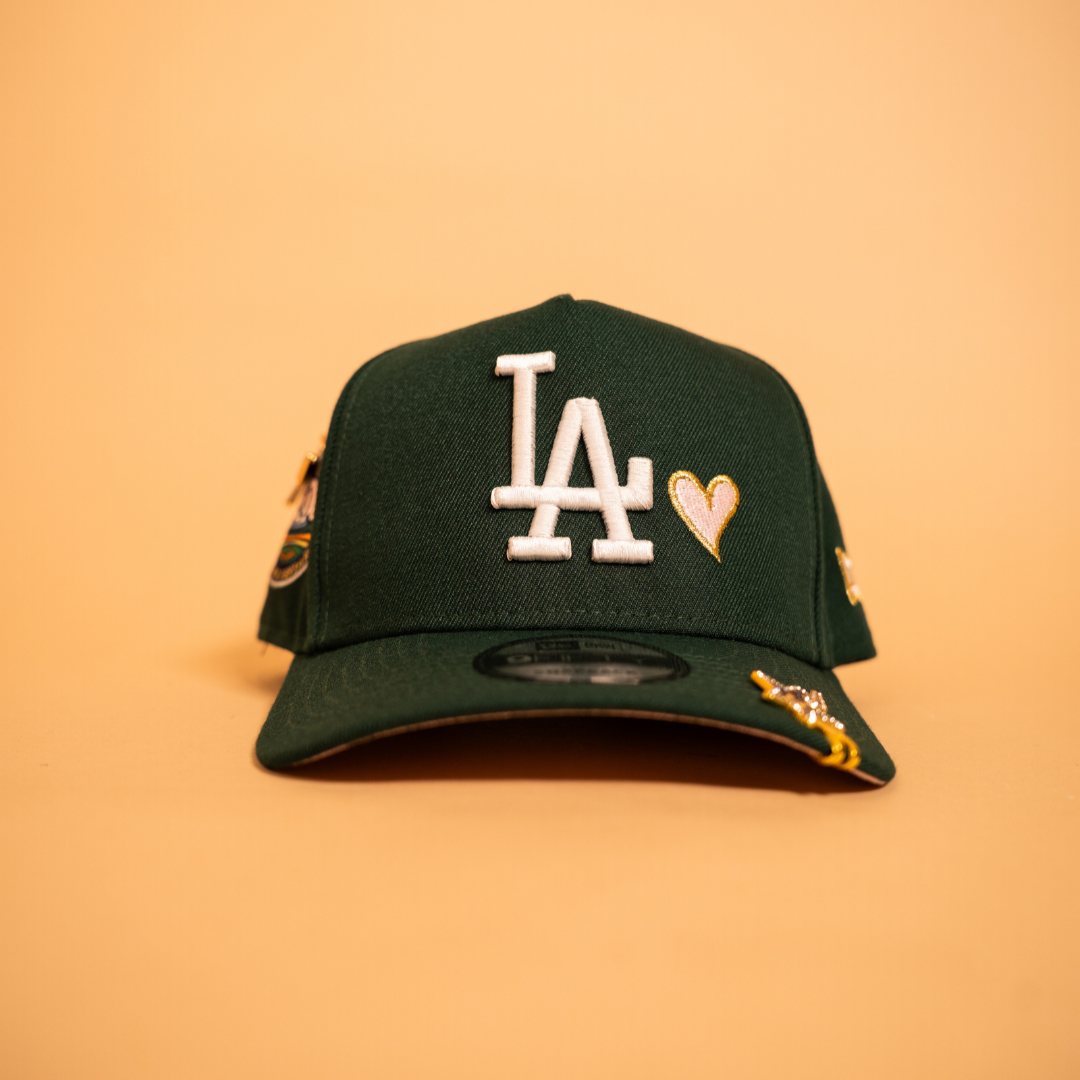 NEW ERA EXCLUSIVE 9FIFTY A-FRAME FOREST GREEN LOS ANGELES DODGERS SNAPBACK W/ PINK HEART + 50TH ANNIVERSARY SIDE PATCH