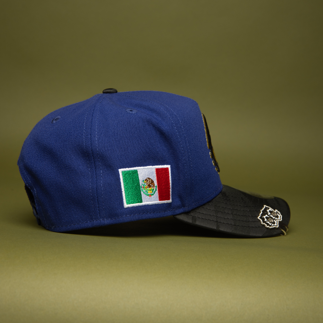 NEW ERA 9FIFTY A-FRAME DARK BLUE/BLACK CAMO CHARROS DE JALISCO SNAPBACK W/ MEXICO FLAG SIDE PATCH