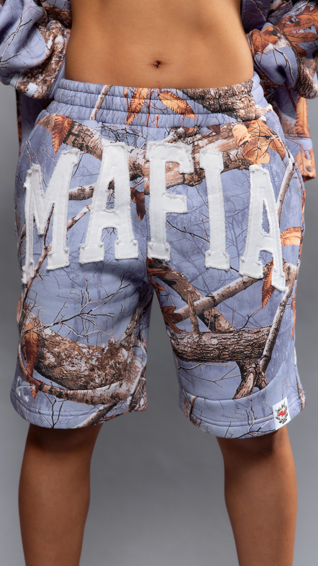 CAP CITY X SHORELINE MAFIA LAVENDER CAMO SHORTS - UNISEX