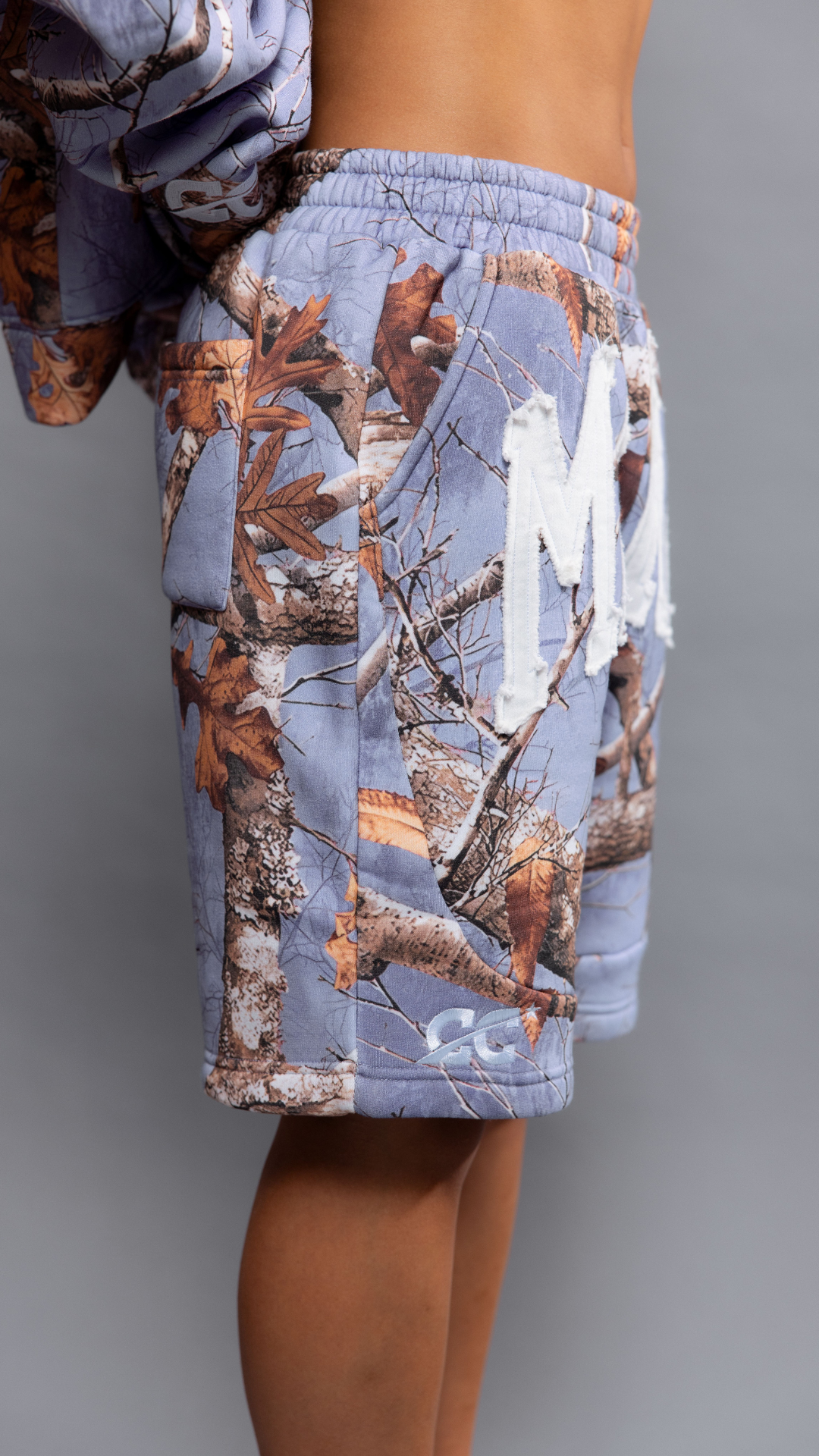 CAP CITY X SHORELINE MAFIA LAVENDER CAMO SHORTS - UNISEX