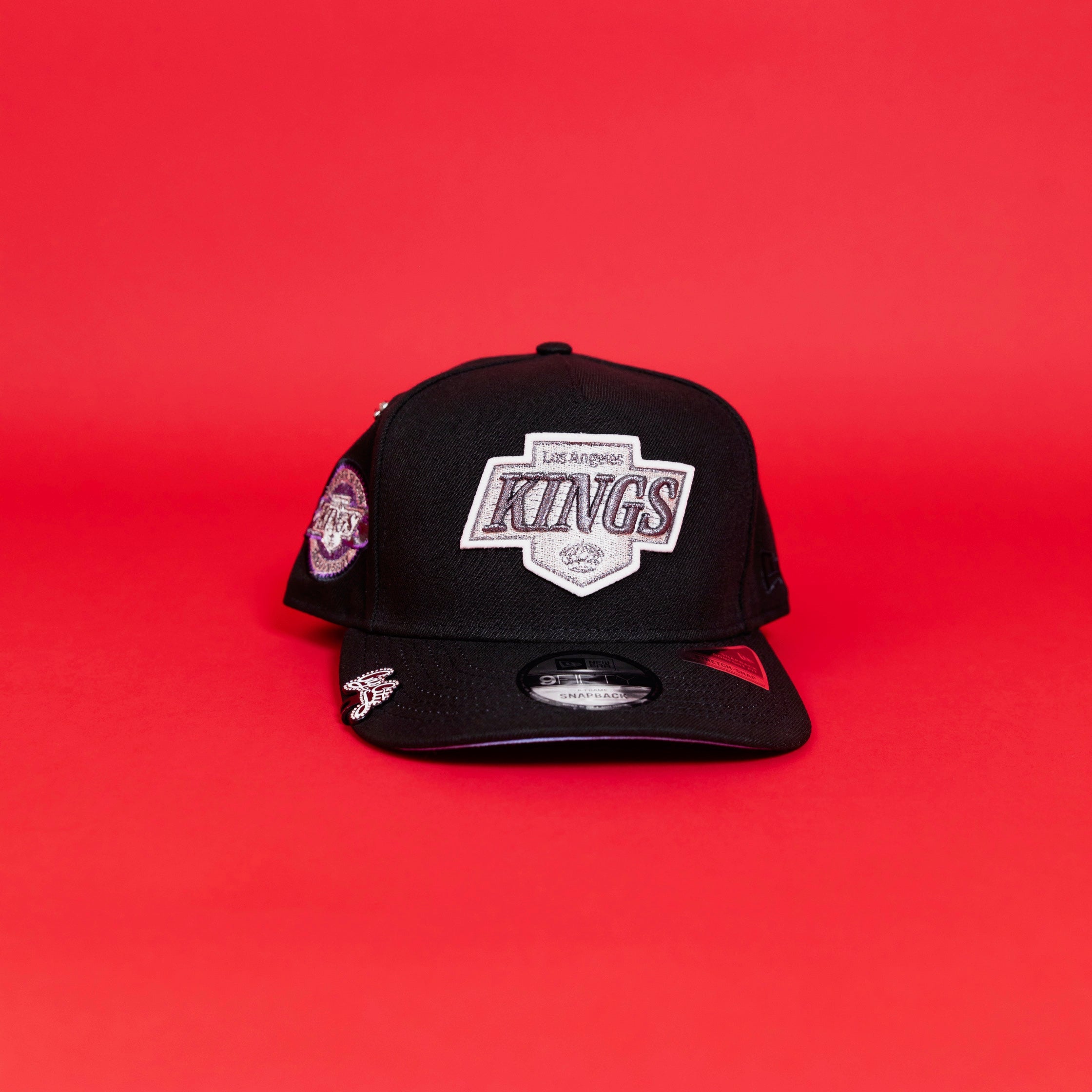 NEW ERA EXCLUSIVE 9FIFTY A-FRAME BLACK LOS ANGELES KINGS SCRIPT SNAPBACK W/ 25TH ANNIVERSARY SIDE PATCH