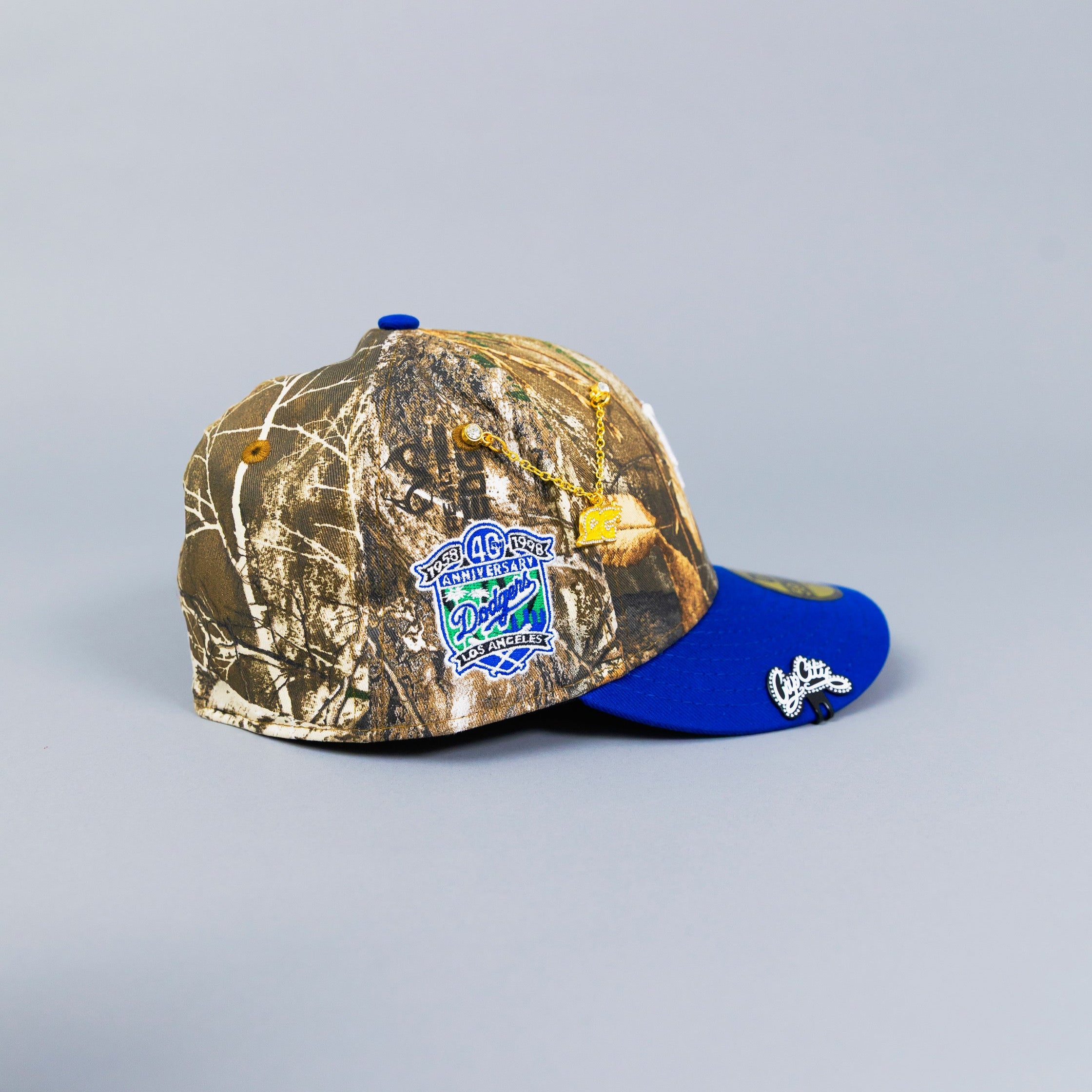 NEW ERA 59FIFTY REALTREE/ BLUE UPSIDE DOWN LOS ANGELES DODGERS W/ 40TH ANNIVERSARY SIDE PATCH