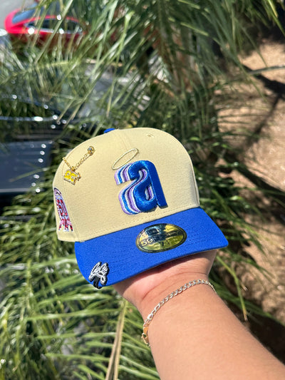 NEW ERA EXCLUSIVE 59FIFTY VEGAS GOLD/BLUE ANAHEIM ANGELS W/ 50TH ANNIVERSARY SIDE PATCH (GREY UV)