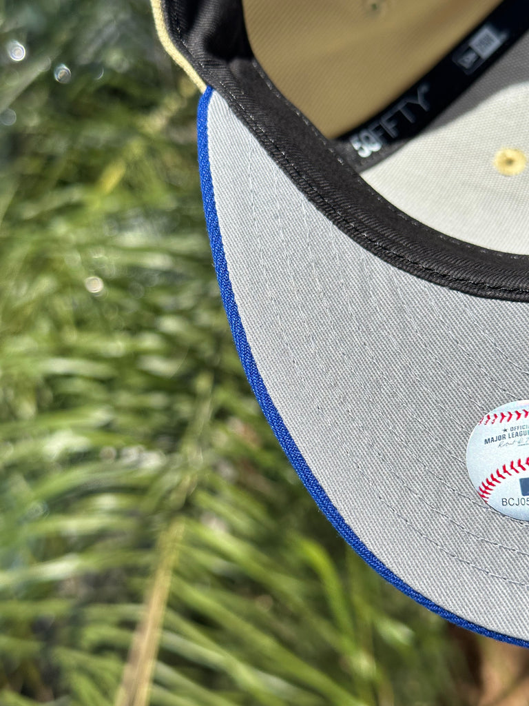 NEW ERA EXCLUSIVE 59FIFTY VEGAS GOLD/BLUE ANAHEIM ANGELS W/ 50TH ANNIVERSARY SIDE PATCH (GREY UV)