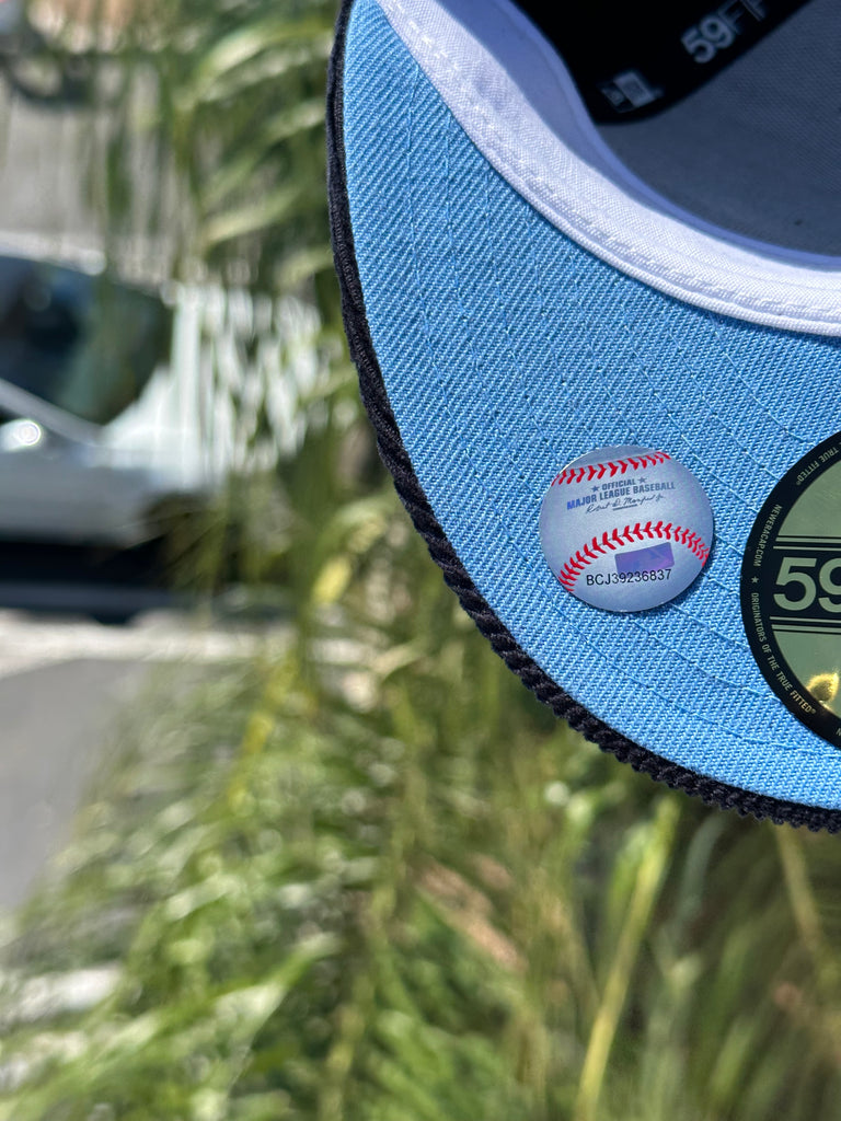 NEW ERA EXCLUSIVE 59FIFTY BLACK/NAVY CORDUROY ANAHEIM ANGELS W/ 25TH ANNIVERSARY SIDEPATCH (SKY BLUE UV) VERY LIMITED