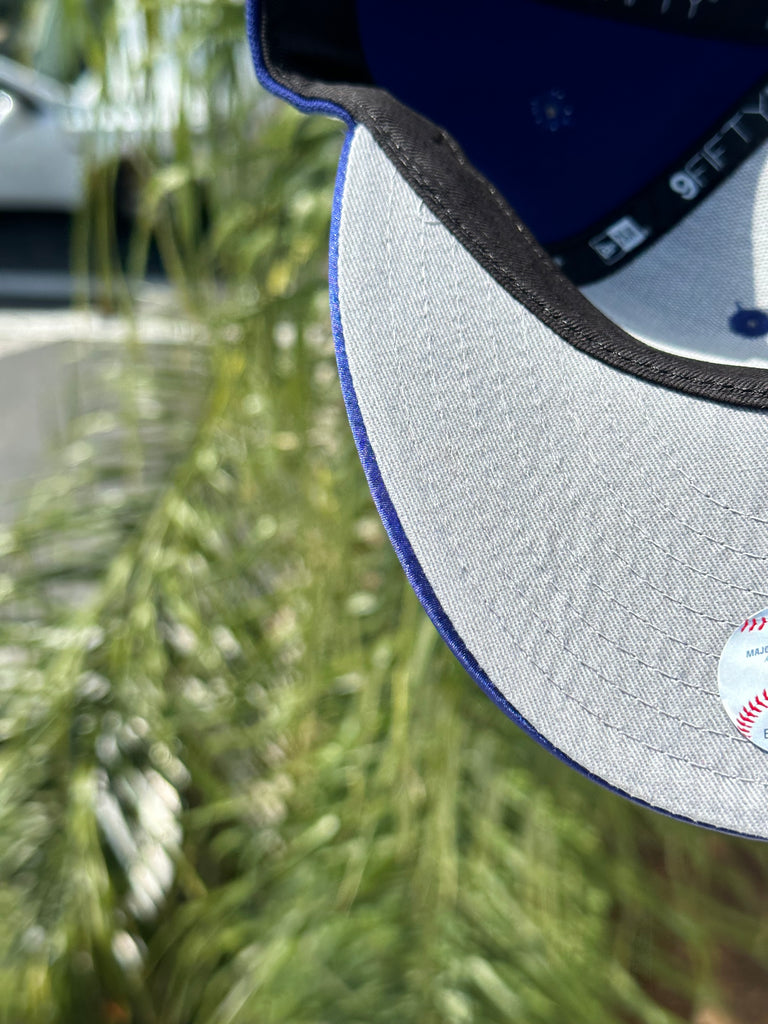 NEW ERA EXCLUSIVE 9FIFTY BLUE/SATIN UPSIDE DOWN LOS ANGELES DODGERS SNAPBACK W/ 60TH ANNIVERSARY PATCH (GREY UV)