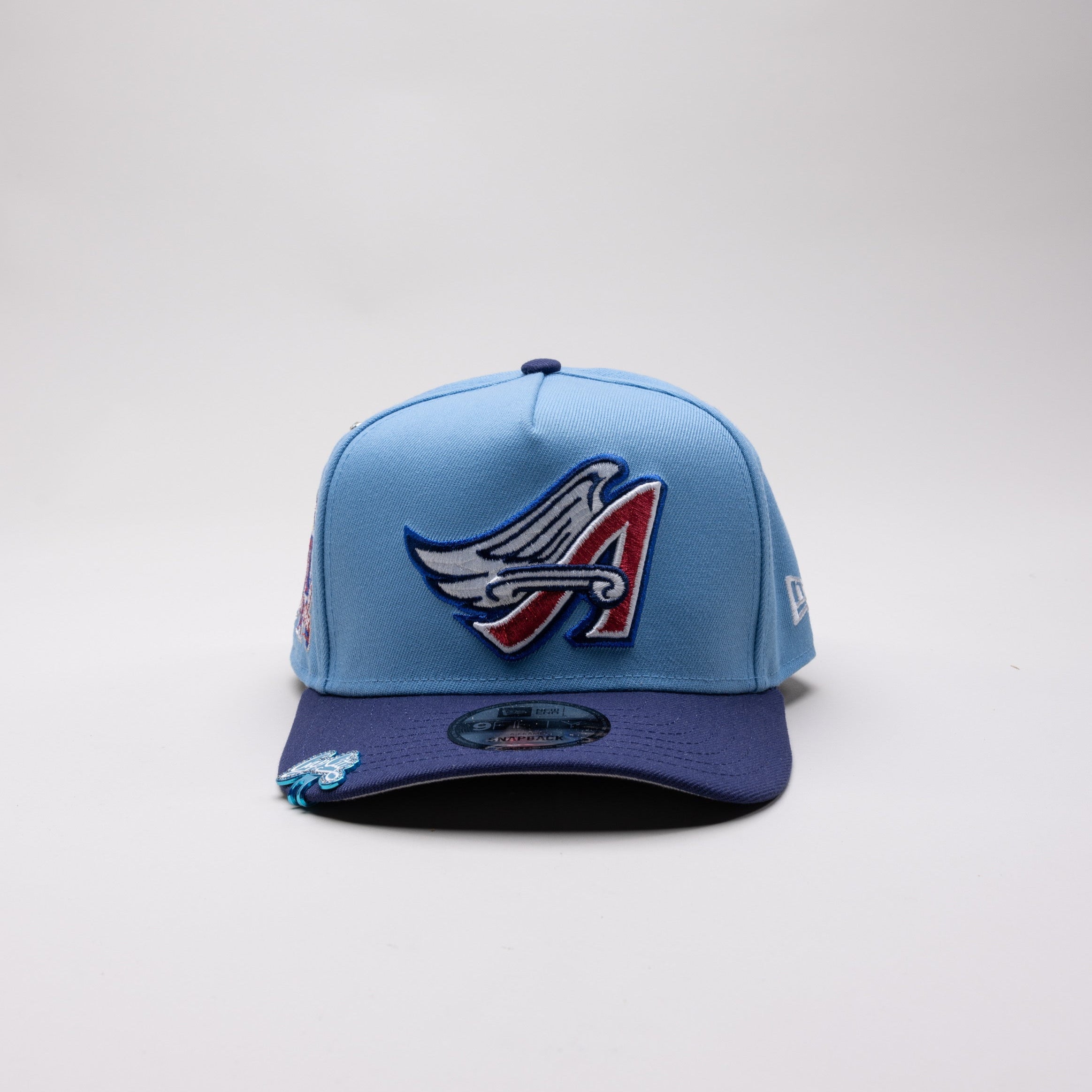 NEW ERA 9FIFTY A-FRAME SKY BLUE/NAVY ANAHEIM ANGELS SNAPBACK W/ 50TH ANNIVERSARY SIDE PATCH