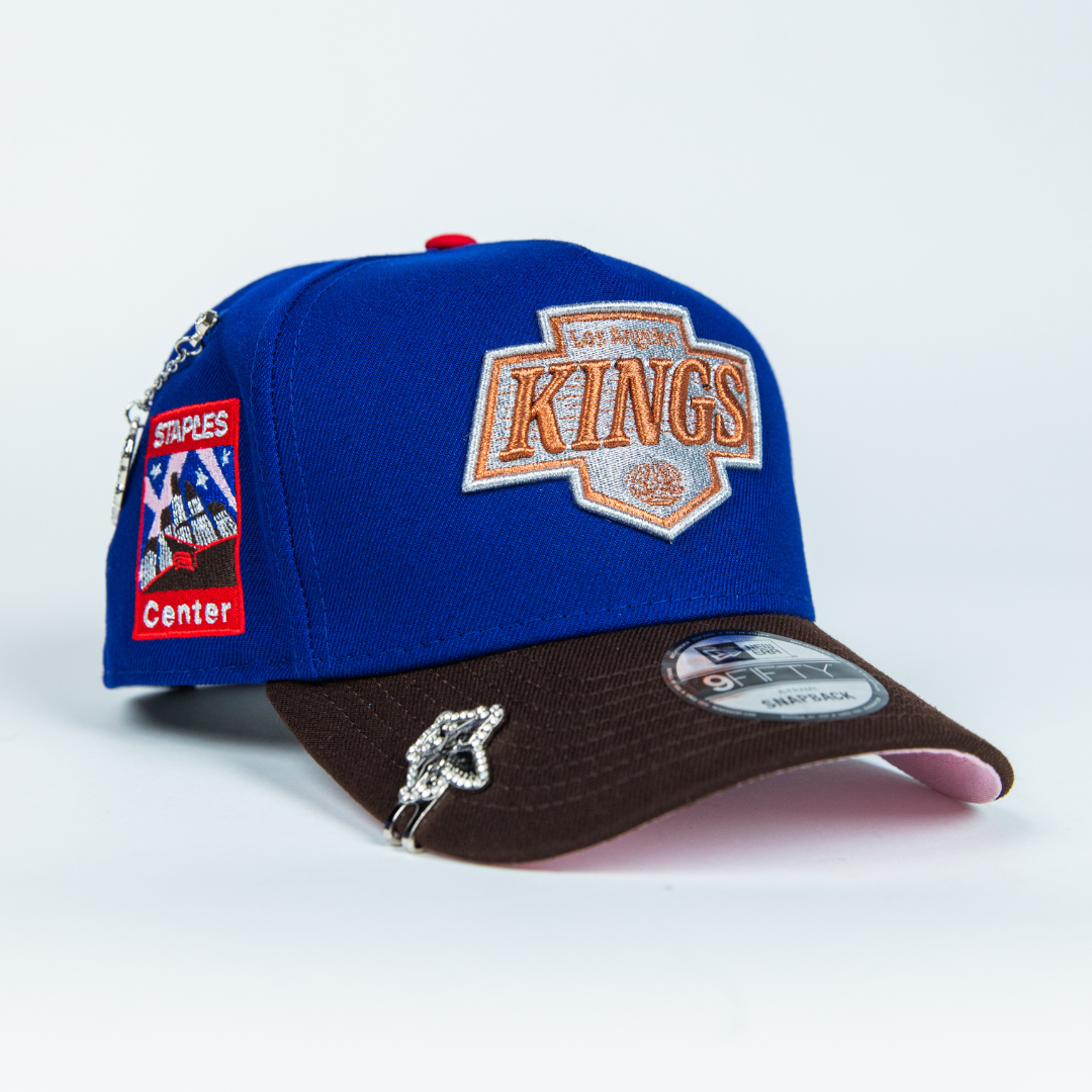 NEW ERA 9FIFTY A-FRAME BLUE/ BROWN LOS ANGELES KINGS SCRIPT SNAPBACK W/ STAPLES CENTER SIDE PATCH