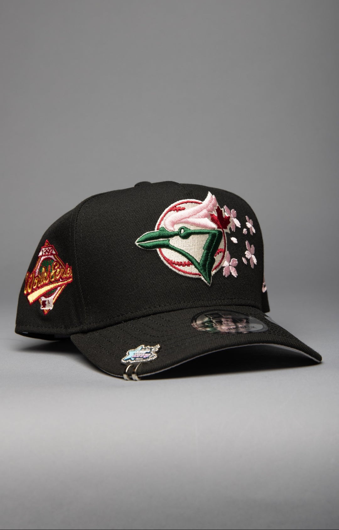 NEW ERA 9FIFTY A-FRAME BLACK TORONTO BLUE JAYS SNAPBACK W/ FLORAL EMBROIDERY + WORLD SERIES SIDE PATCH