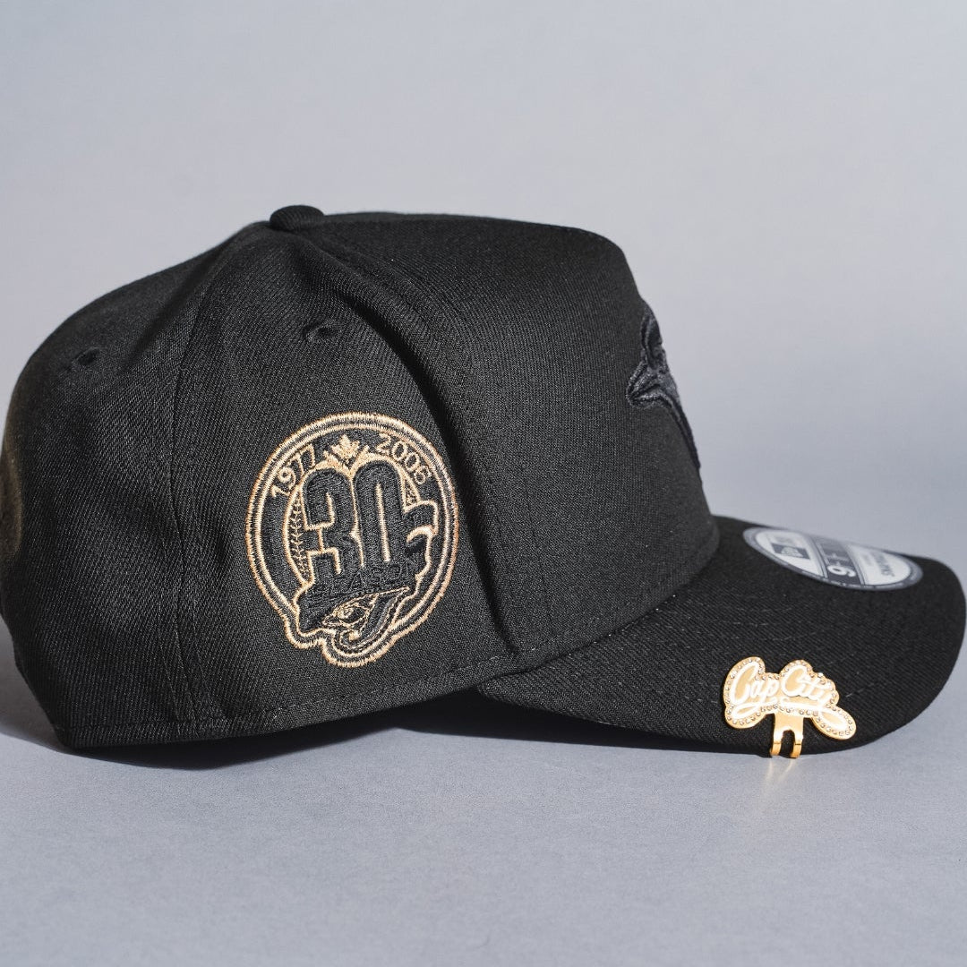 NEW ERA 9FIFTY A-FRAME BLACKED OUT TORONTO BLUE JAYS SNAPBACK W/ 30TH ANNIVERSARY SIDE PATCH