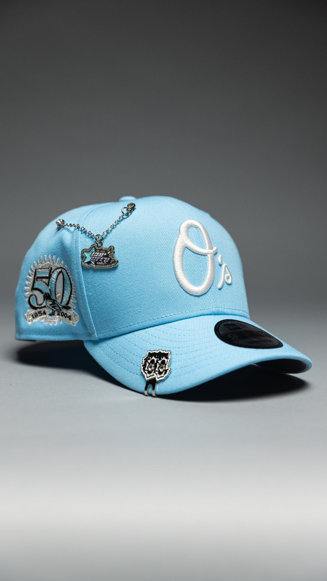 NEW ERA EXCLUSIVE 9FIFTY ICY BLUE BALTIMORE ORIOLES SNAPBACK W/ 50TH ANNIVERSARY SIDE PATCH