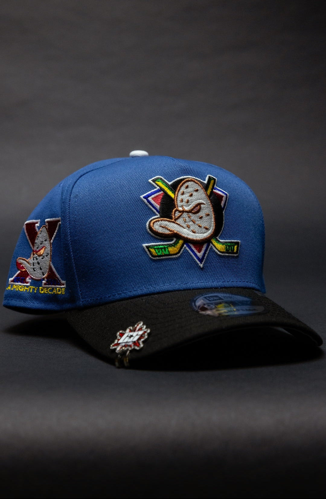 NEW ERA 9FIFTY A-FRAME COBALT ANAHEIM DUCKS SNAPBACK W/ "A MIGHTY DECADE" SIDE PATCH