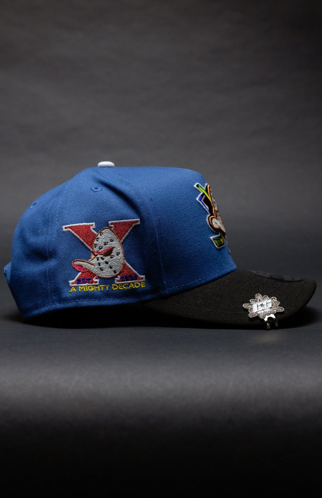 NEW ERA 9FIFTY A-FRAME COBALT ANAHEIM DUCKS SNAPBACK W/ "A MIGHTY DECADE" SIDE PATCH