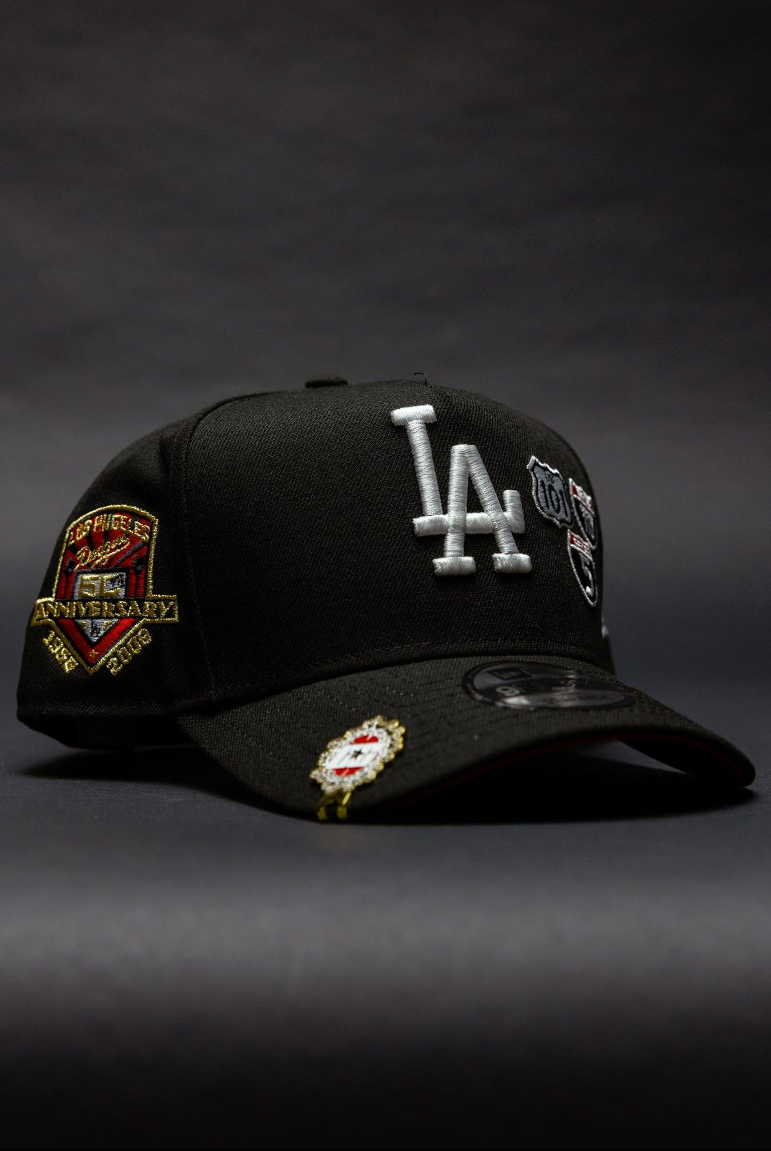 NEW ERA 9FIFTY A-FRAME BLACK LOS ANGELES DODGERS SNAPBACK W/ INTERSTATE + 50TH ANNIVERSARY SIDE PATCH