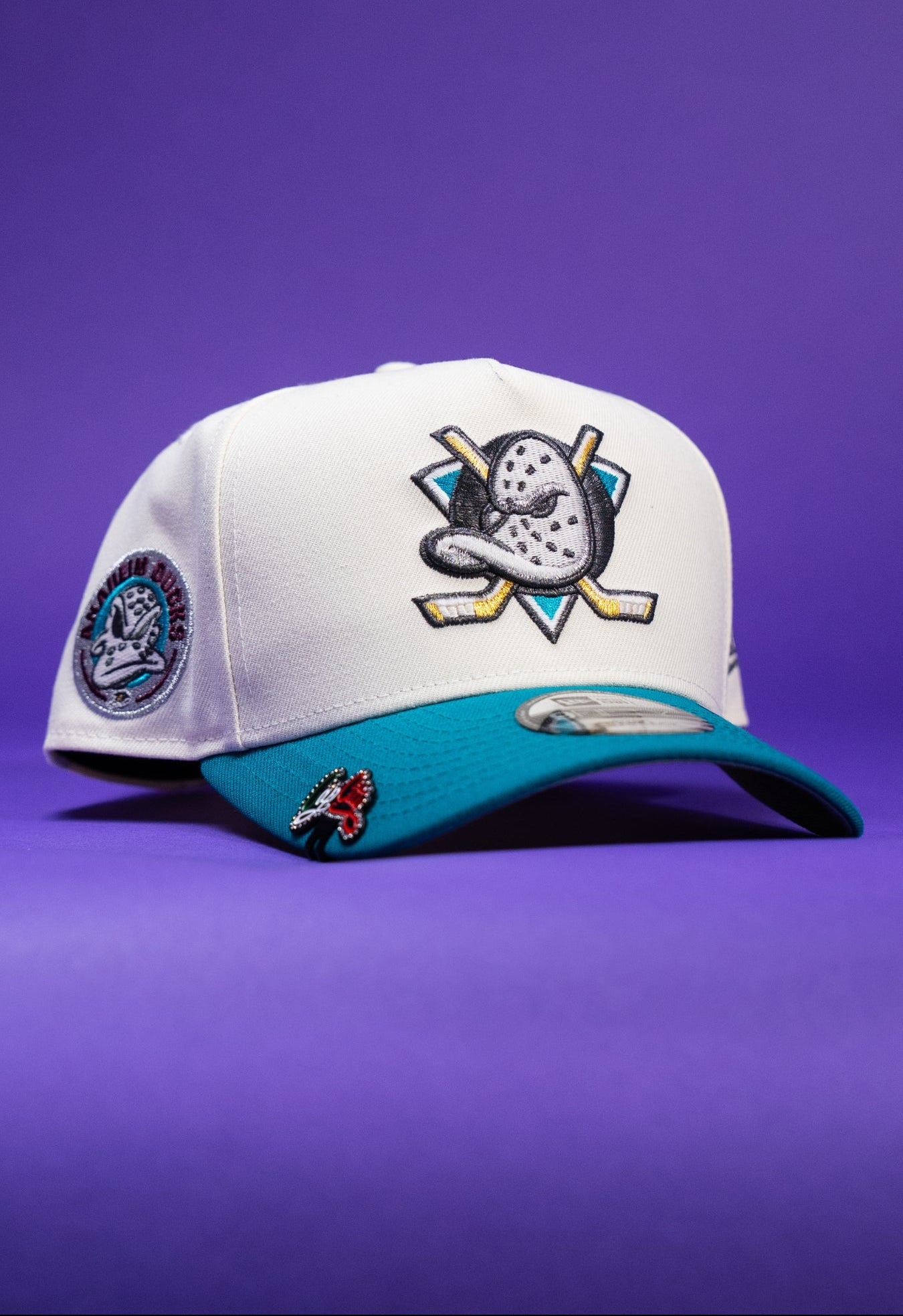 NEW ERA 9FIFTY A-FRAME CHROME/TURQUOISE ANAHEIM DUCKS SNAPBACK W/ "DUCKS" SIDE PATCH