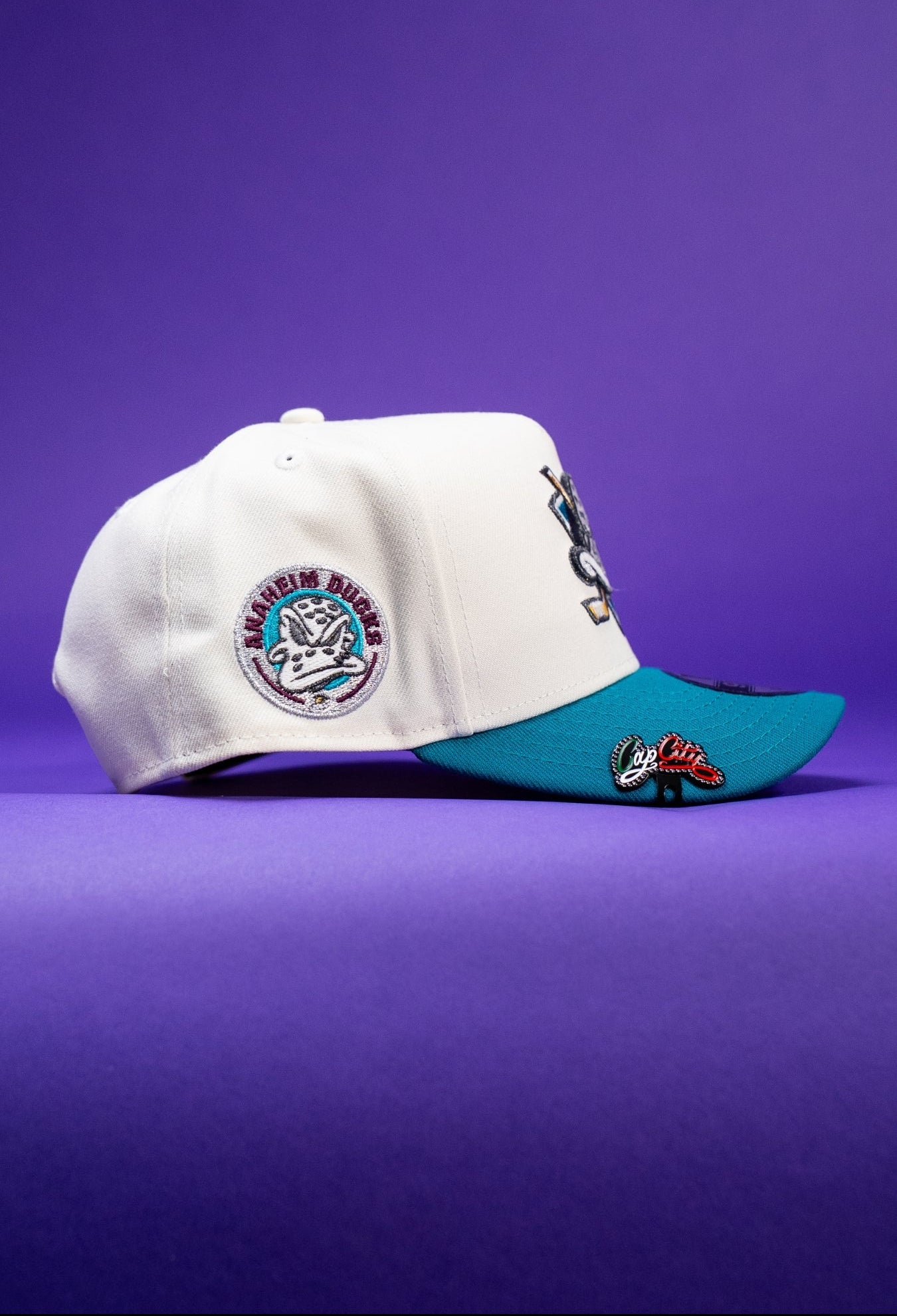 NEW ERA 9FIFTY A-FRAME CHROME/TURQUOISE ANAHEIM DUCKS SNAPBACK W/ "DUCKS" SIDE PATCH