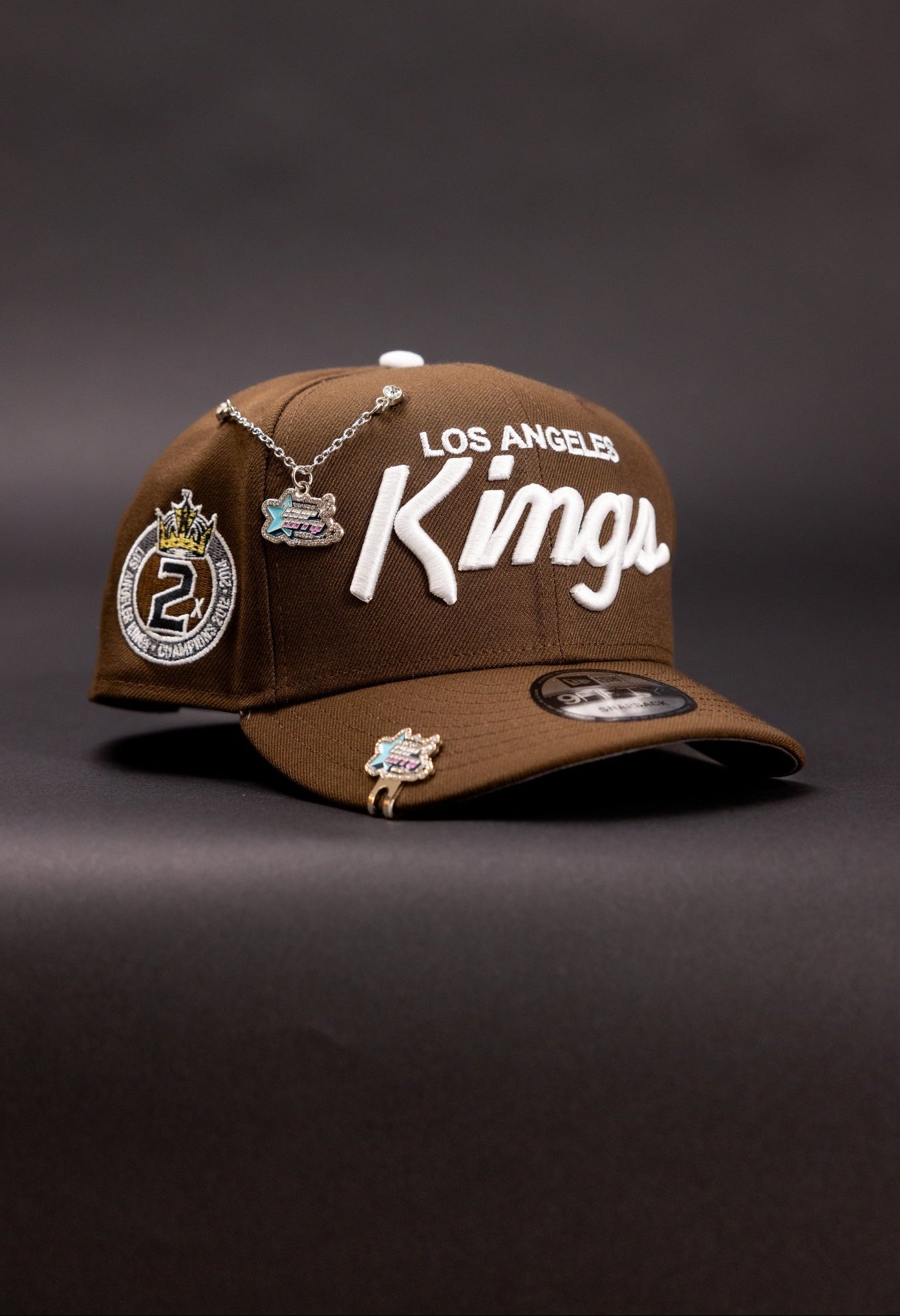 NEW ERA 9FIFTY BROWN LOS ANGELES KINGS SCRIPT SNAPBACK W/ "2X CHAMPS" SIDE PATCH