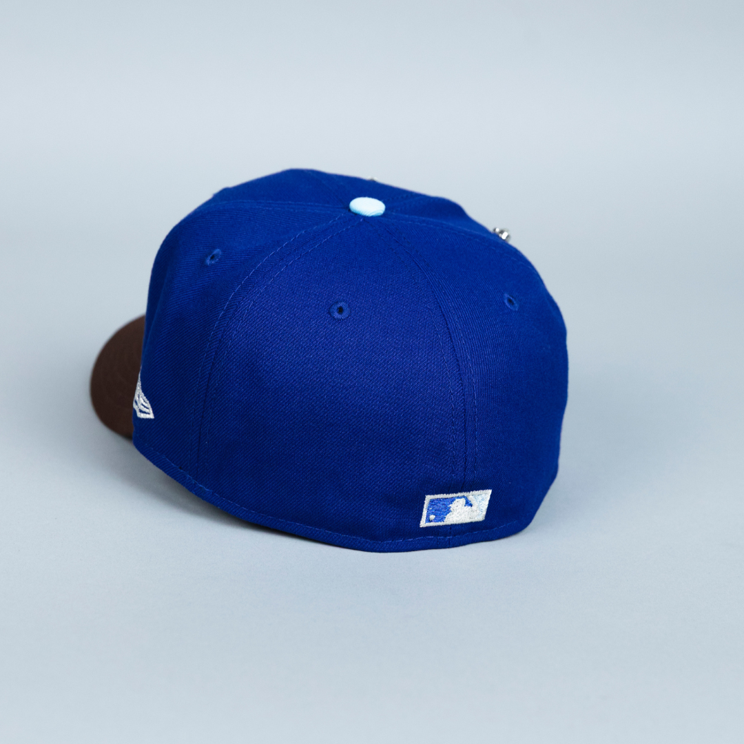 NEW ERA EXCLUSIVE 59FIFTY DARK BLUE/ BROWN ATLANTA BRAVES W/ 1999 WORLD SERIES SIDE PATCH