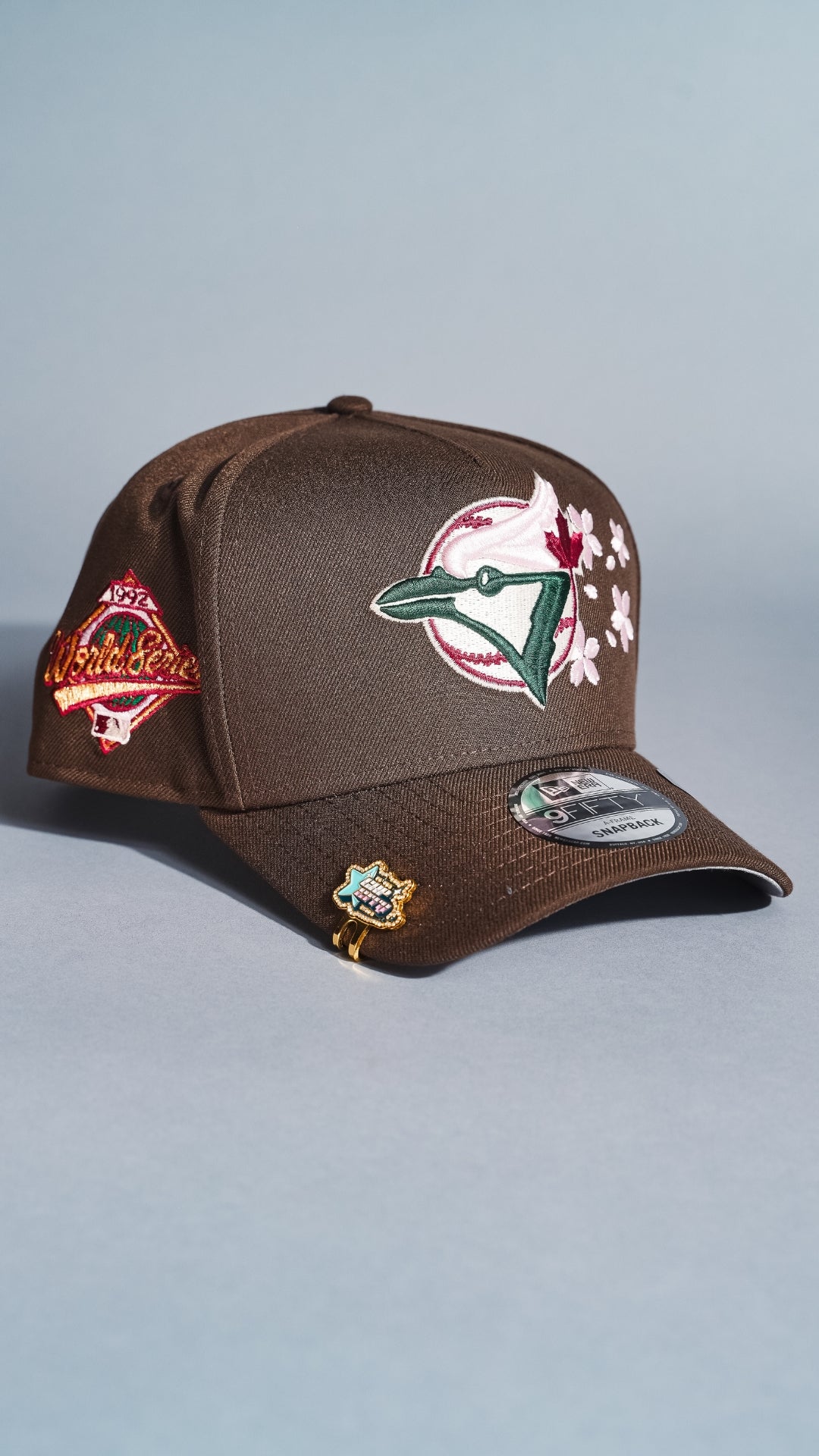 NEW ERA 9FIFTY A-FRAME BROWN TORONTO BLUE JAYS SNAPBACK W/ FLORAL EMBROIDERY + WORLD SERIES SIDE PATCH